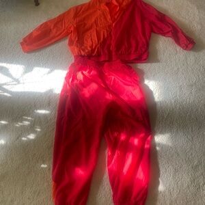 Women’s Adidas sweatsuit red and orange. This item is used.